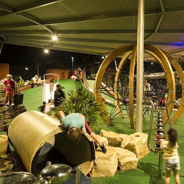 busy playground with outdoor musical instruments in the Casuarina Precinct Darwin, Australia