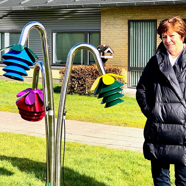 Rainbow coloured outdoor musical flowers installed outside the Hassinghave Carehome for residents to play