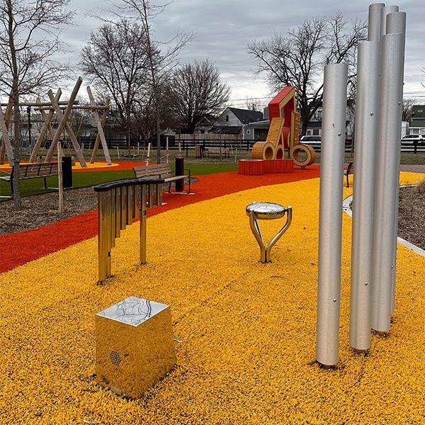 outdoor musical instruments and climbing structure in a playground in Lousiville