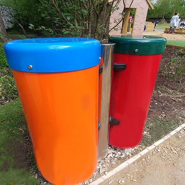 a pair of colourful outdoor conga drums (one red one orange) in the Paddington Recreation Ground sensory trail