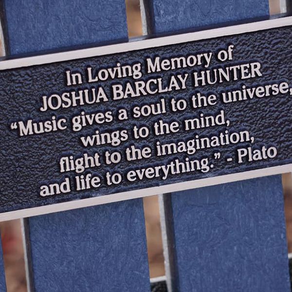 a plaque with musical quote found on a bench in the Quinterra Musical Legacy Garden in Calgary