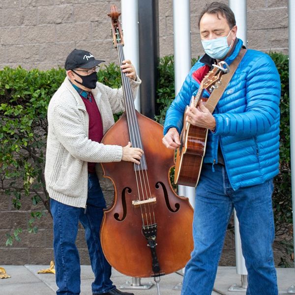 musicians playing outdoor musical instruments at the opening ceremony of the Modesto Gallo Center's new outdoor music garden