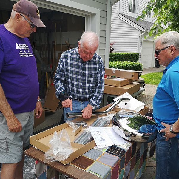 3 men building a babel drum for the Belleville Rotary music garden