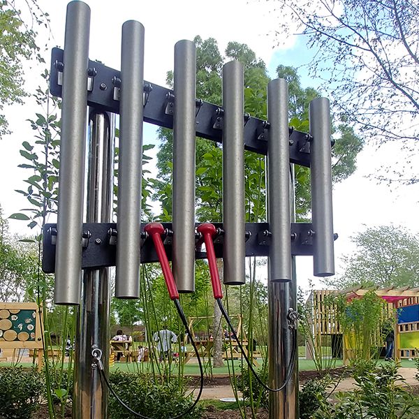 a set of outdoor musical chimes on stainless steel legs in the paddington recreation ground sensory trail