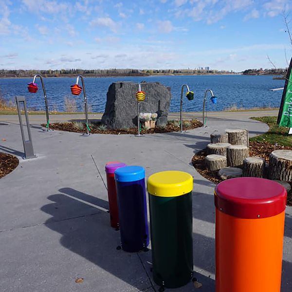 the view across the Quinterra Musical Legacy Garden in Calgary to the lake behind 