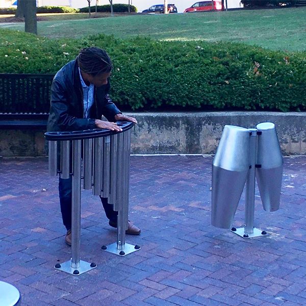 Jonathan Whitney, a local Wilmington percussionist playing the new outdoor musical instruments in the  H. Fletcher Brown Park