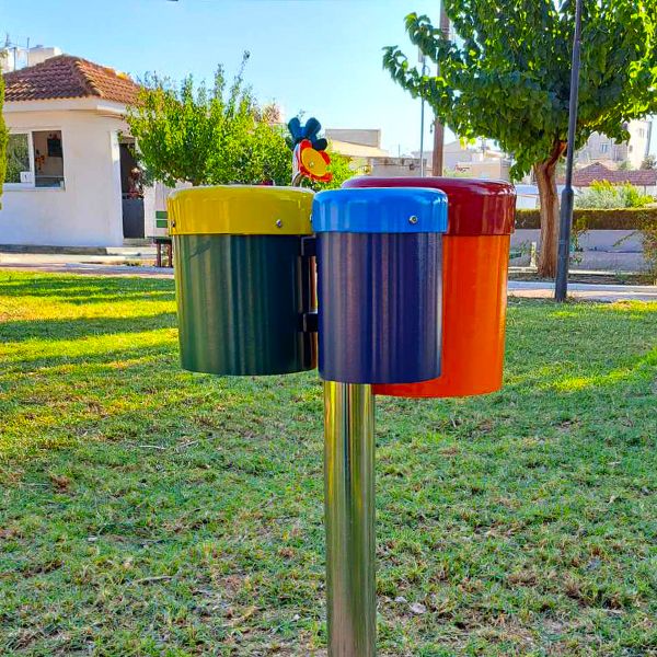 outdoor bongo drums on a stainless steel post in a community park