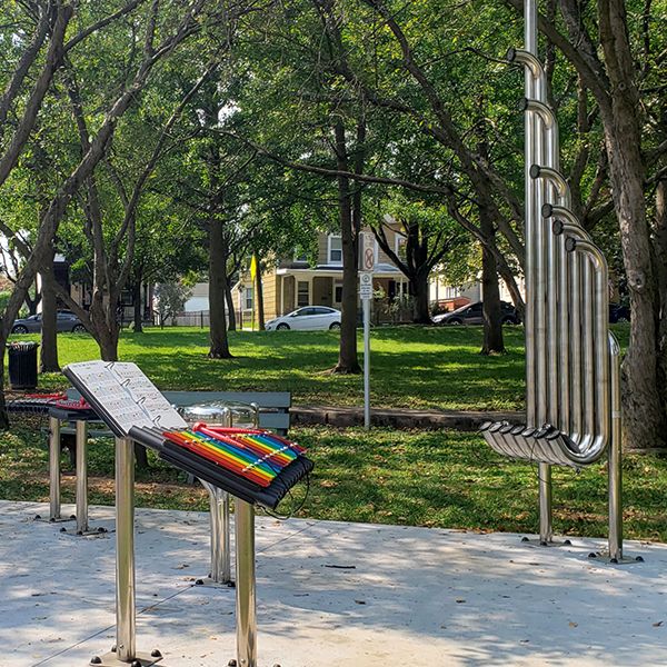 a rainbow colored xylophone and large musical pipes called tembos in Gavin's memorial music park