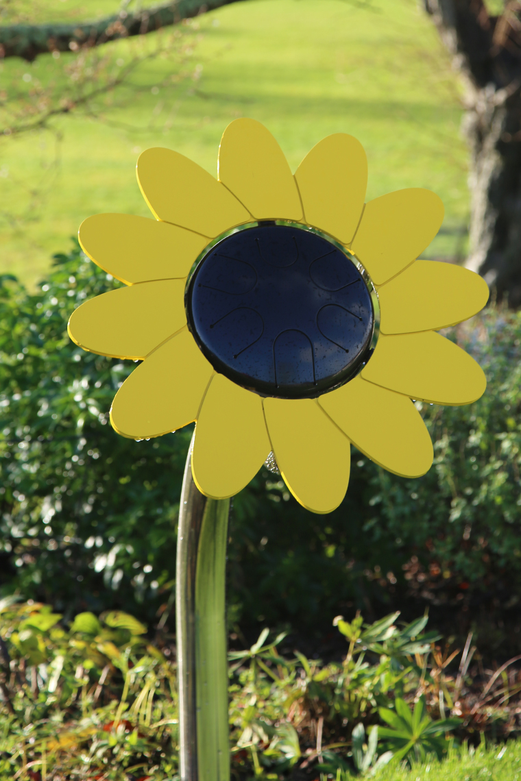 an outdoor musical drum in the shape and colours of a daisy