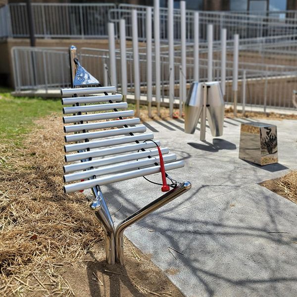 silver outdoor xylophone installed outside the oil city public library