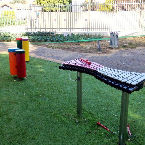 outdoor drums and xylophone stood in school playground