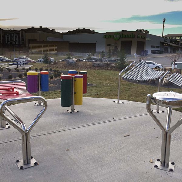 a collection of outdoor musical instruments in the outdoor classroom at Buffalo Rubbing Stone Elementary School in Canada