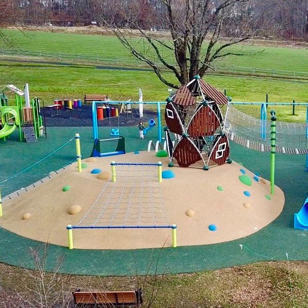 Birds eye view of the lion pride park playground and outdoor music grove