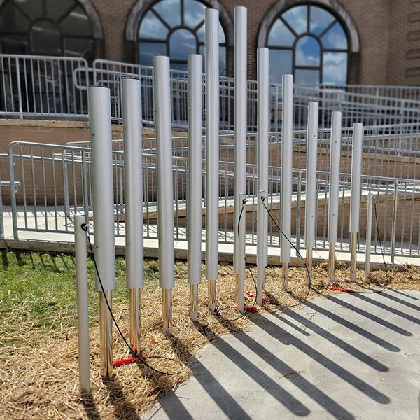 Large tall silver chimes installed outside the oil city public library