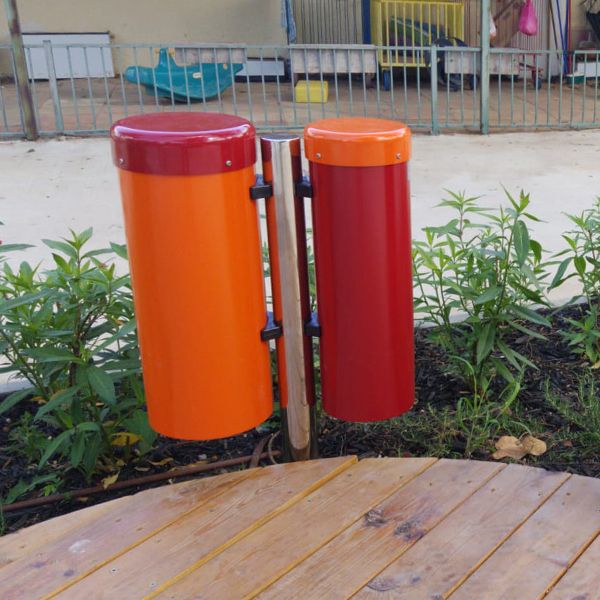 a pair of red and orange outdoor conga drums in the musical playground in Kibbutz Magal