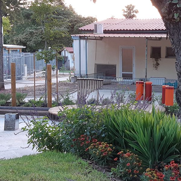 the new musical playground with red/orange conga drums, stainless steel cajon drums, handpipes and rainbow xylophone at the new musical playground at Kibbutz Magal 