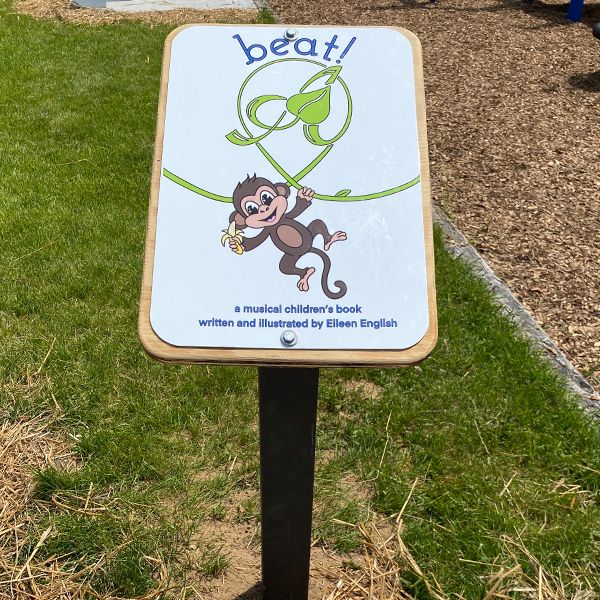 a story book post with a picture of a monkey in Sheboyan Music Park