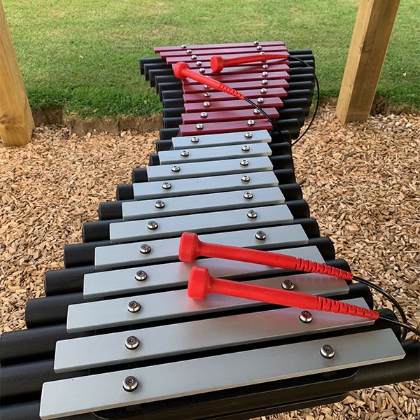 Outdoor xylophone with pink and silver notes at the Thomas Centre Music Pavilion