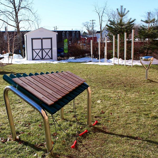 the outdoor musical instruments in the dino garden of liverpool public library in New York