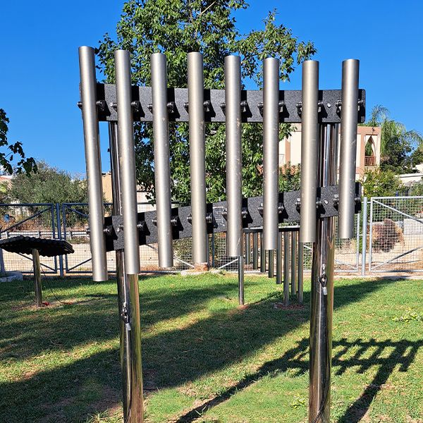 silver outdoor musical chimes in a park in cyprus