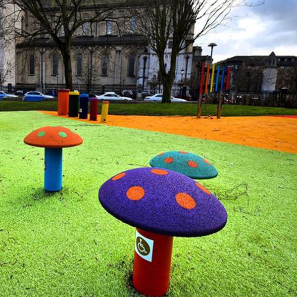 colourful mushrooms and outdoor musical drums in the inclusive music park in cathedral gardens, Belfast, Northern Ireland