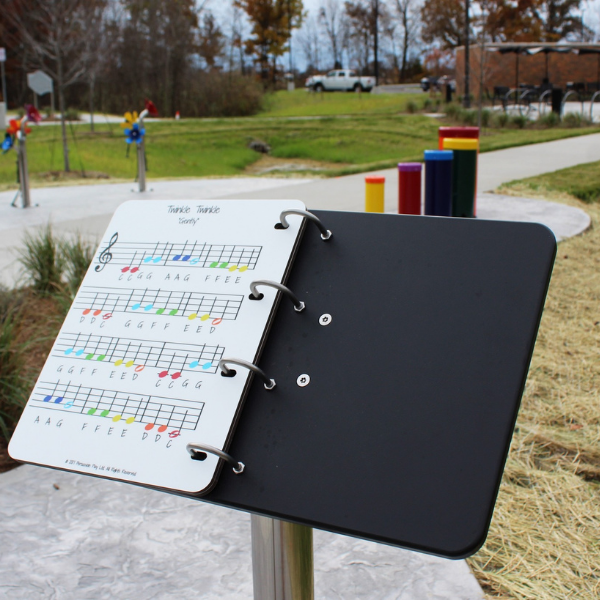 an outdoor book showing colored musical notes