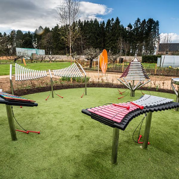 a collection of outdoor musical instruments in the playful garden in Brodie Castle, National Trust Scotland