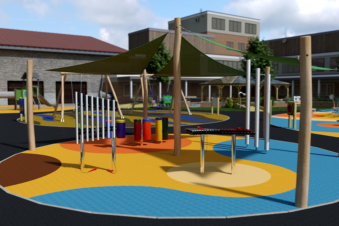 Colorful outdoor playground featuring musical instruments under a shaded canopy, surrounded by circular play areas and a backdrop of buildings.