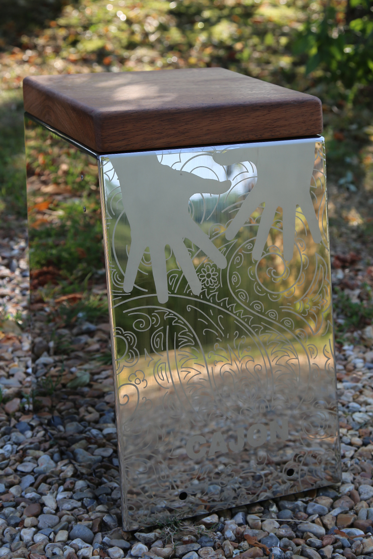 a stainless steel outdoor cajon drum with a wooden seat for musical parks and playgrounds