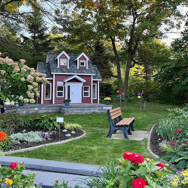 image of Brighton District Library Garden with Musical Flowers and Small Outhouse