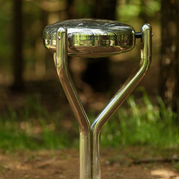 a stainless steel tongue drum in a musical playground at the Sirvetos Regional Park