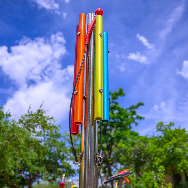 an outdoor musical chime post in a music playground