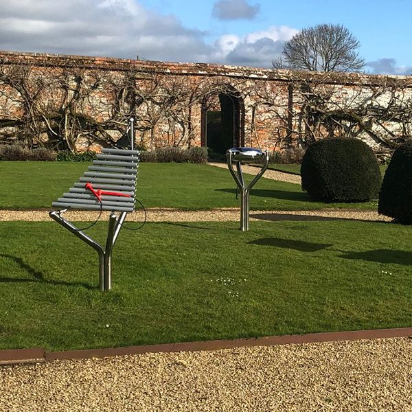 two outdoor musical instruments - one metallophone and one steel tongue drum installed in the gounds of north cadbury court