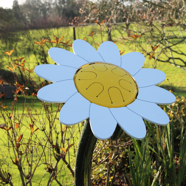 an outdoor musical drum in the shape and colours of a daisy