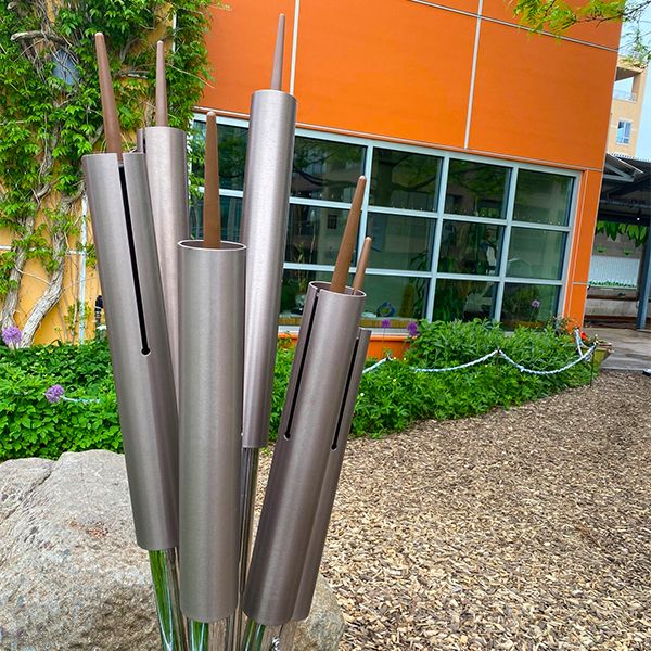 outdoor musical chimes shaped like cattails on the rooftop garden at Madison Childrens Museum