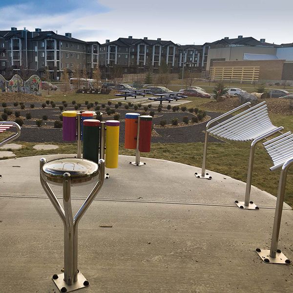 a collection of outdoor musical instruments in the outdoor classroom at Buffalo Rubbing Stone Elementary School in Canada