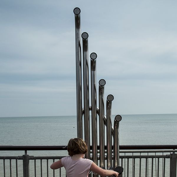 Girl Playing Large Aerophones on Boscombe Pier 