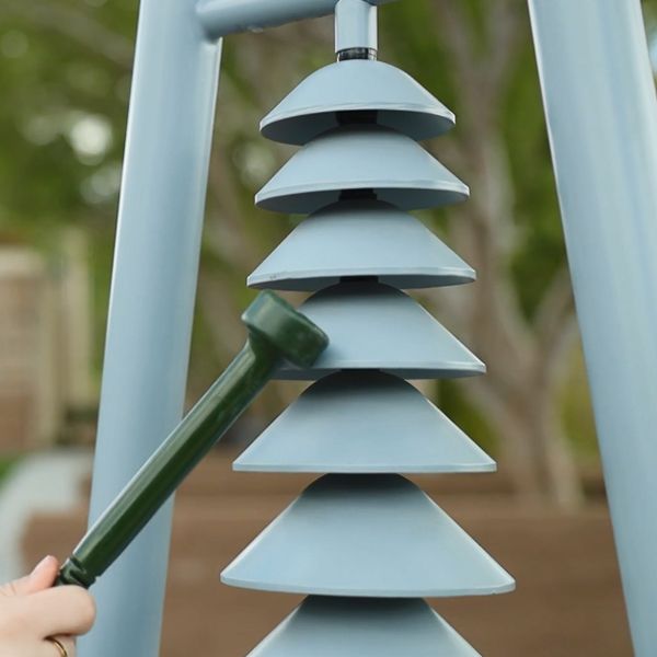 A close up image of the percussion play outdoor musical instrument the bell lyre in the Hansen Memorial garden arizona