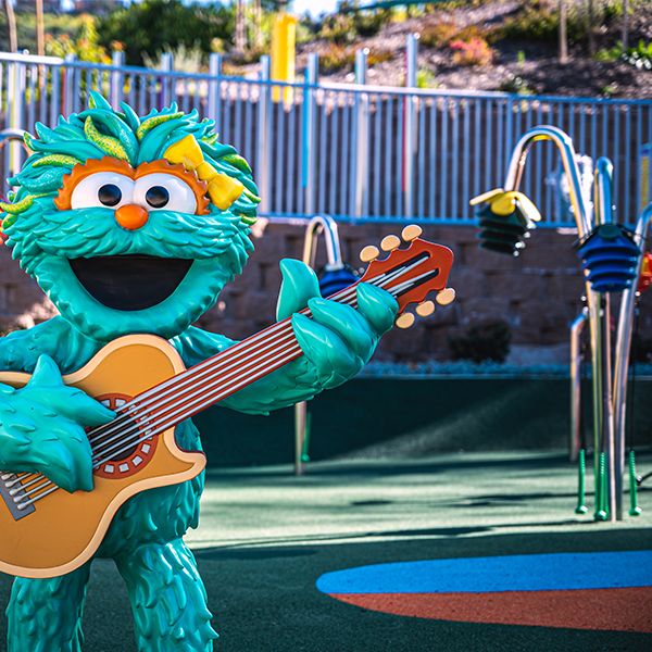 sesame street character playing a guitar in the sesame street music park at seaworld