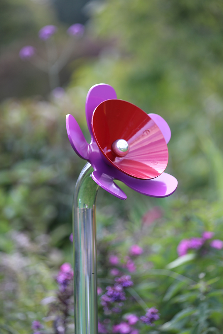 a flower shaped outdoor musical bell for sensory gardens and playgrounds