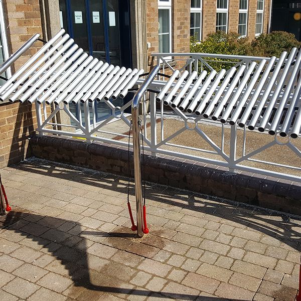 special needs school playground with outdoor musical instruments installed