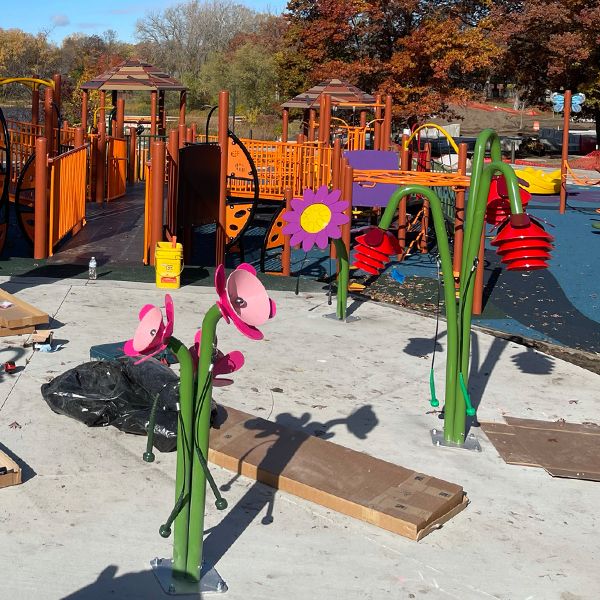 St Croix installation team creating an outdoor playground with outdoor musical instruments