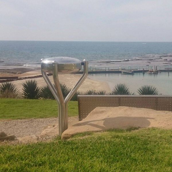 two stainless steel tongue drums installed overlooking the sea in kibbutz