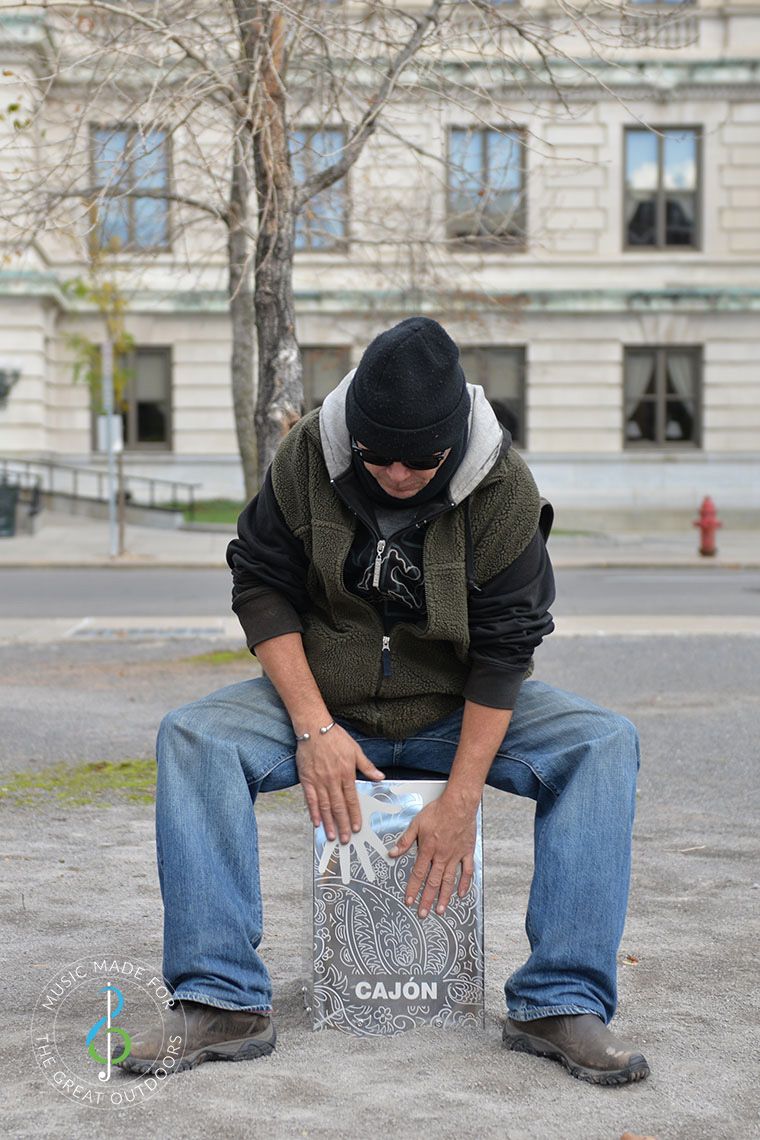 Man Playing Outdoor Cajon Drum in Street 