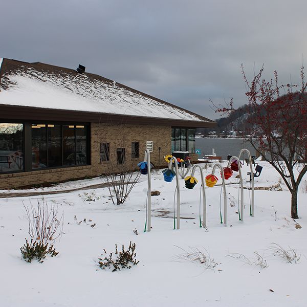 outdoor musical instruments shaped like flowers in the snow outside Benzies Shore Library