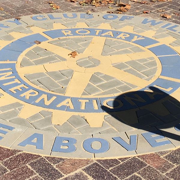 the rotary logo in brick on the ground of the new rotary outdoor musical park in Wilmington USA