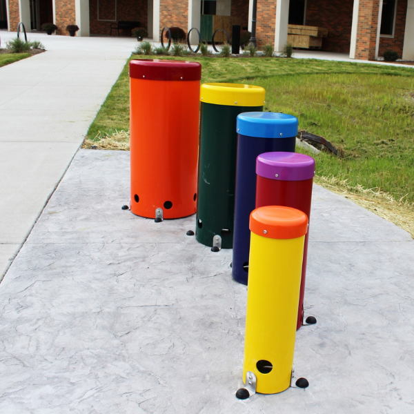 set of five rainbow colored outdoor musical drums