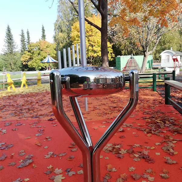 a large stainless steel outdoor tongue drum in a musical playground in Pori Finland