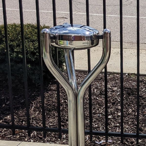 a stainless steel outdoor tongue drum located outside the Scenic Regional Library St Clair Branch