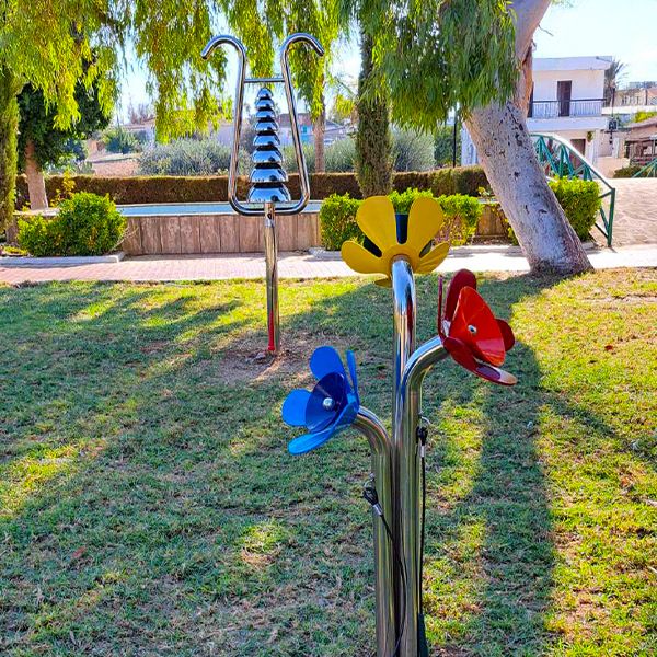 outdoor musical instrument in the shape of three large flowers in bright colours